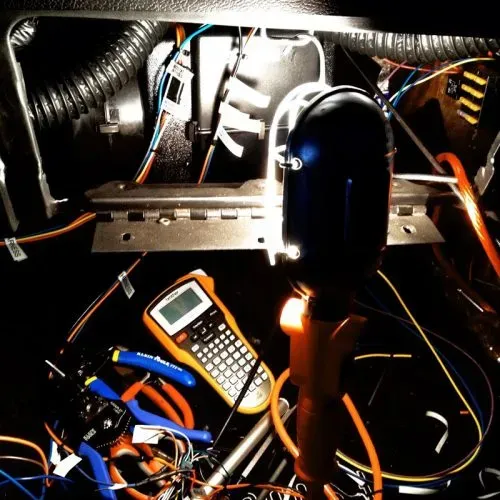 Illustration of common car electrical problems like dead batteries and wiring issues in a garage setting.